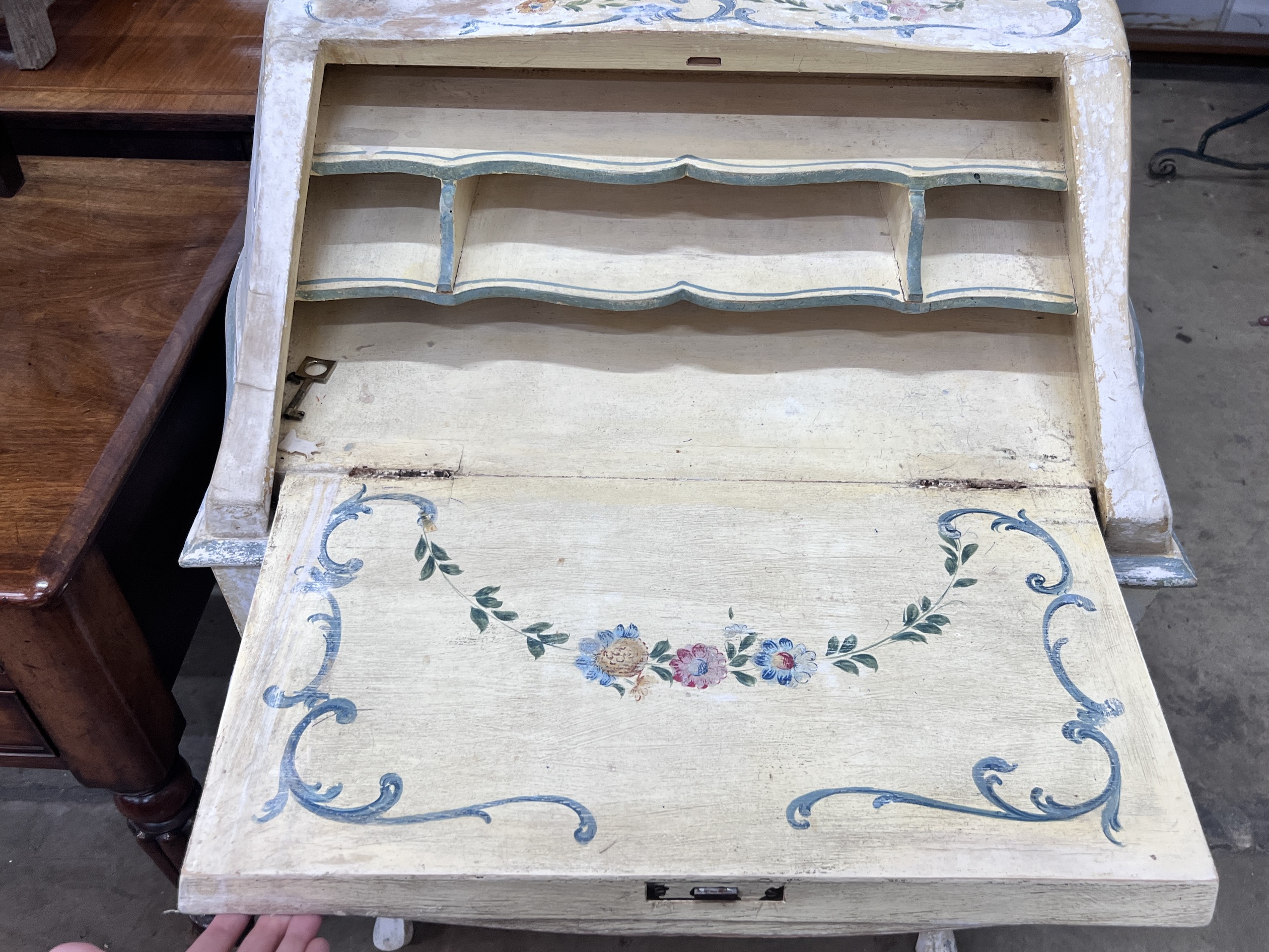 An Italian style painted serpentine front bureau, width 75cm, depth 46cm, height 102cm
